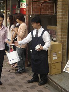 Jap Man_handing_out_Advertising_Tissues