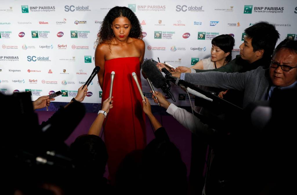 This image has an empty alt attribute; its file name is naomi-osaka-interview-red-dress.jpeg